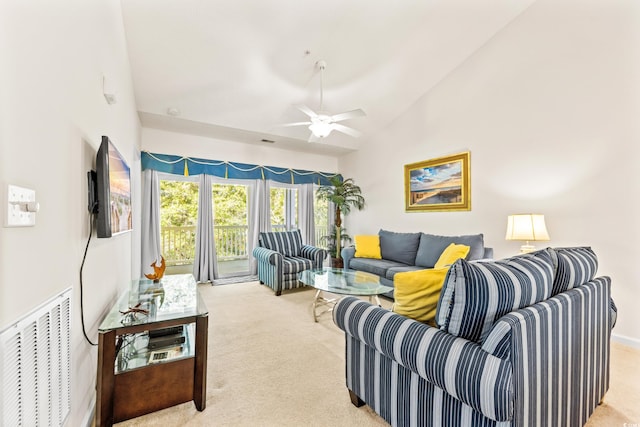 living room with light colored carpet, high vaulted ceiling, and ceiling fan