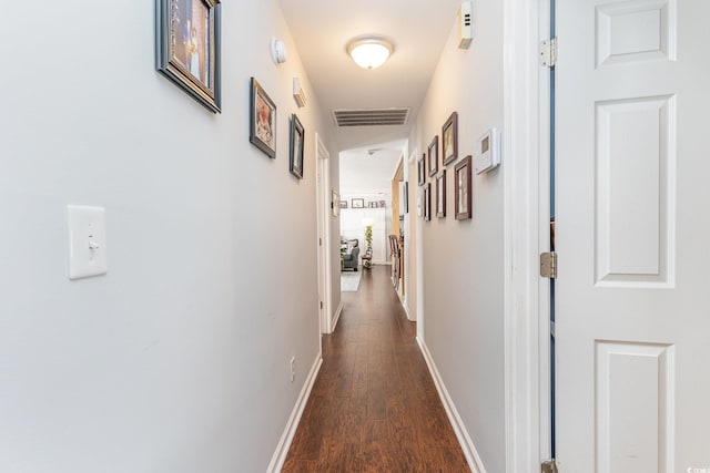 hall with dark wood-type flooring