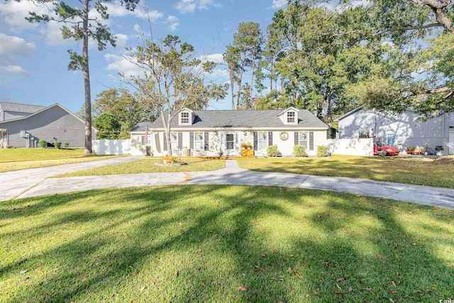 cape cod-style house featuring a front lawn