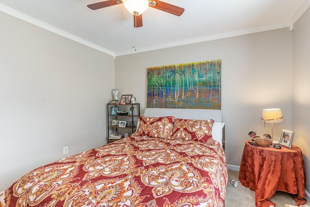 bedroom with ornamental molding, carpet, and ceiling fan