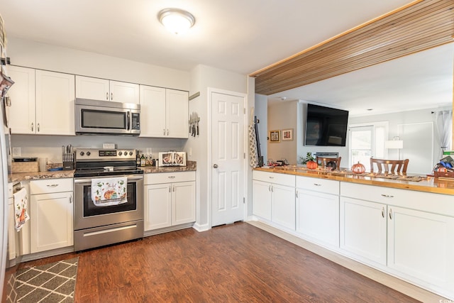 kitchen featuring white cabinets, stainless steel appliances, and dark hardwood / wood-style flooring