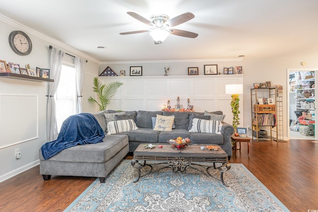 living room featuring ceiling fan, ornamental molding, and hardwood / wood-style floors