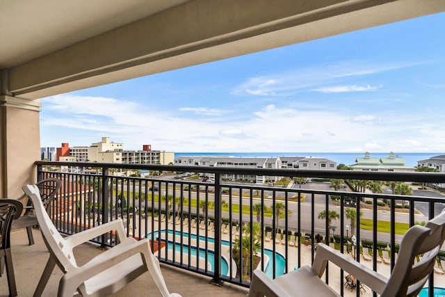 balcony featuring a water view