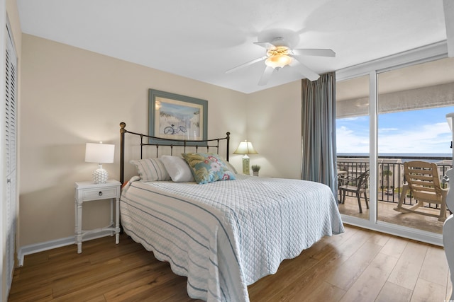 bedroom featuring hardwood / wood-style floors, access to outside, and ceiling fan