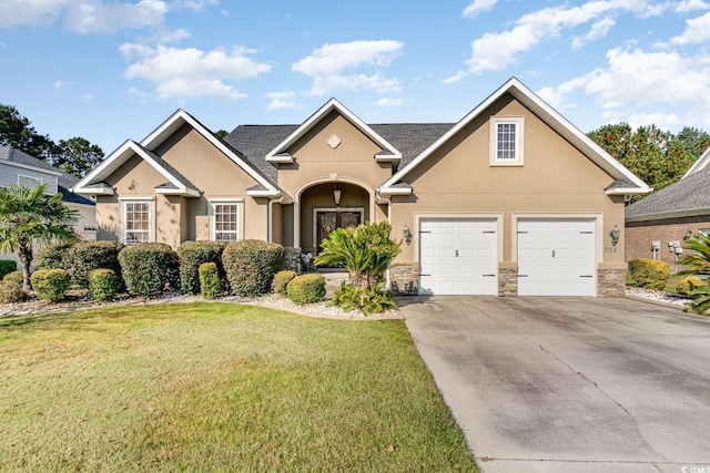 view of front of house with a front yard and a garage