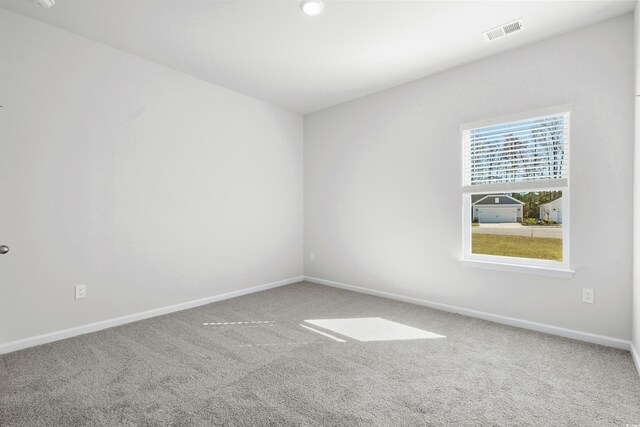 unfurnished room featuring carpet flooring