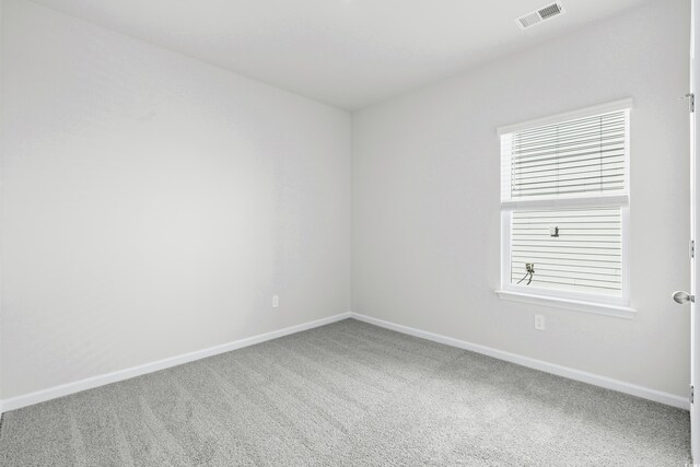 unfurnished room with carpet floors