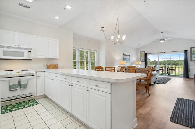 kitchen with light hardwood / wood-style floors, kitchen peninsula, white cabinetry, and white appliances