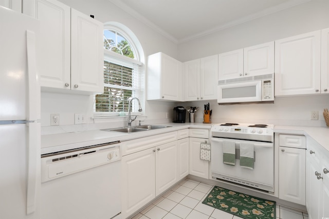 kitchen featuring light tile patterned floors, white cabinetry, ornamental molding, sink, and white appliances