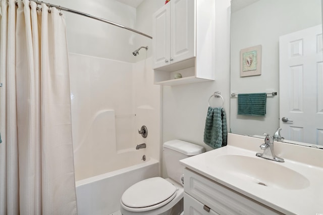 full bathroom with toilet, vanity, and shower / tub combo