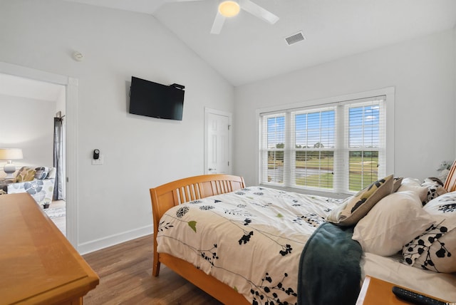 bedroom with lofted ceiling, hardwood / wood-style floors, and ceiling fan