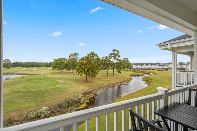 balcony featuring a water view