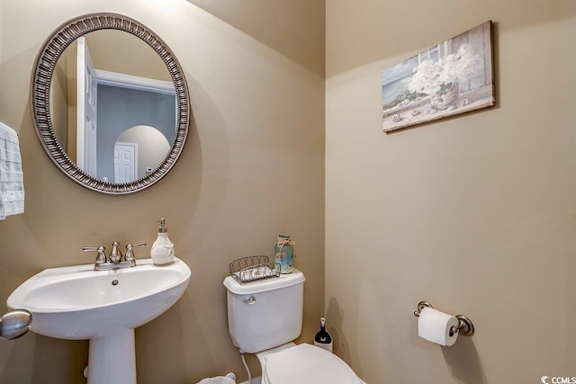 bathroom with a sink and toilet