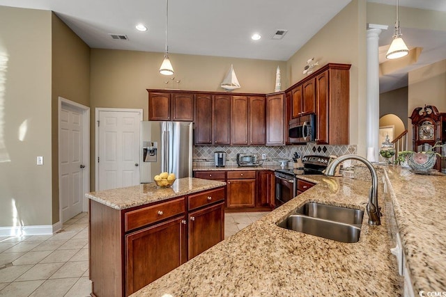 kitchen with visible vents, a sink, light tile patterned flooring, and stainless steel appliances