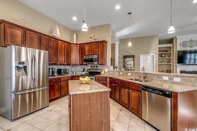 kitchen featuring decorative backsplash, a peninsula, a sink, light tile patterned floors, and stainless steel appliances