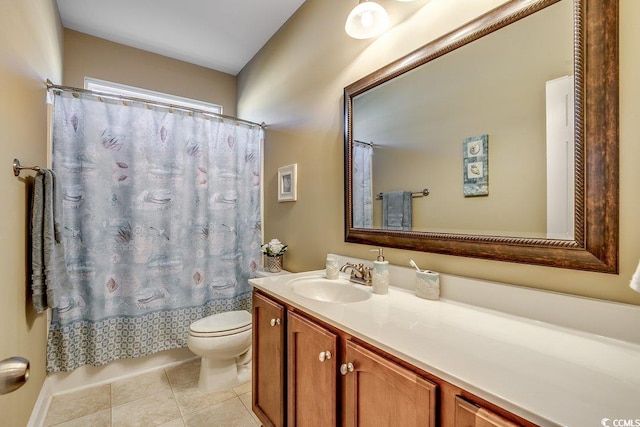 bathroom with toilet, tile patterned floors, and vanity