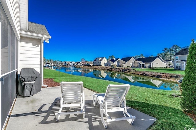 view of patio / terrace featuring a water view and a residential view