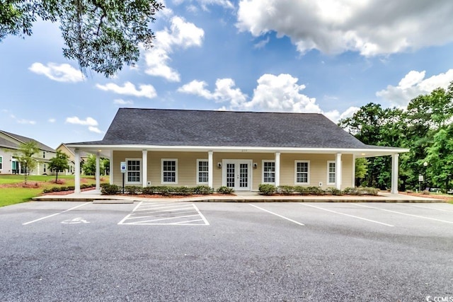 view of building exterior with uncovered parking