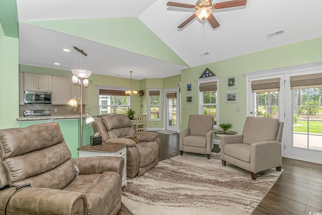 living room featuring recessed lighting, visible vents, ceiling fan with notable chandelier, and dark wood-type flooring