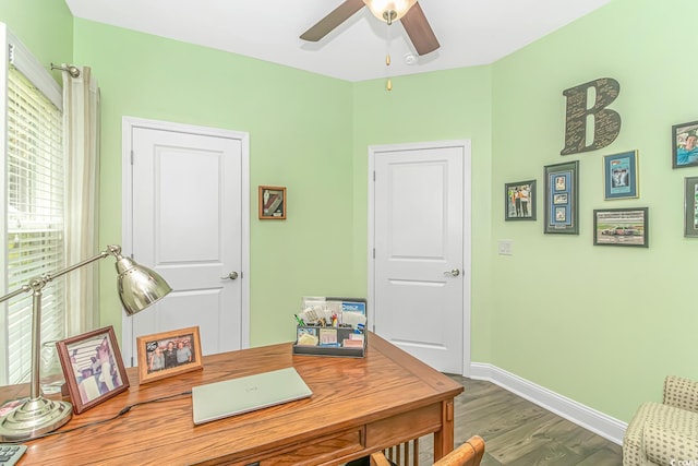 office space featuring wood finished floors, baseboards, and ceiling fan