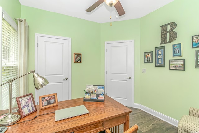 home office with ceiling fan, baseboards, and wood finished floors