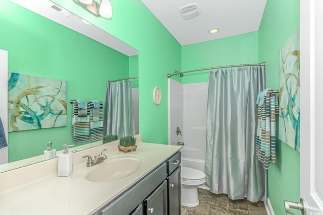 bathroom featuring visible vents, shower / bath combo with shower curtain, toilet, and vanity