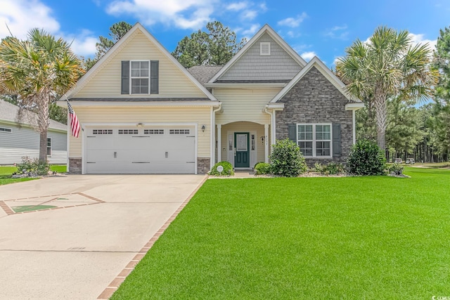 craftsman inspired home featuring a garage, a front yard, concrete driveway, and stone siding