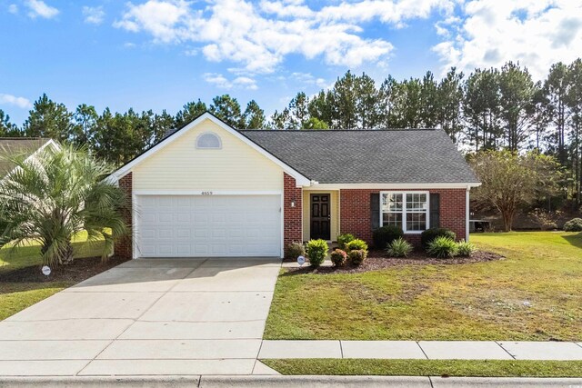 ranch-style home with a front lawn and a garage