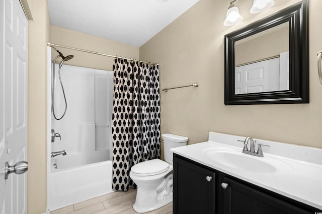 bathroom with toilet, shower / bath combo with shower curtain, wood finished floors, and vanity