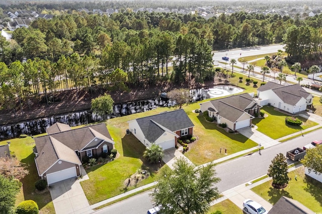 bird's eye view with a water view and a residential view