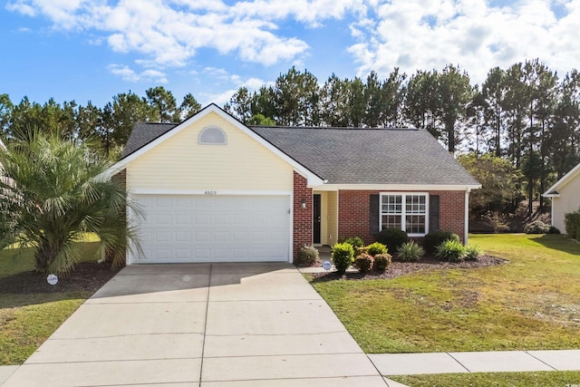 view of front of house featuring a garage, concrete driveway, brick siding, and a front yard