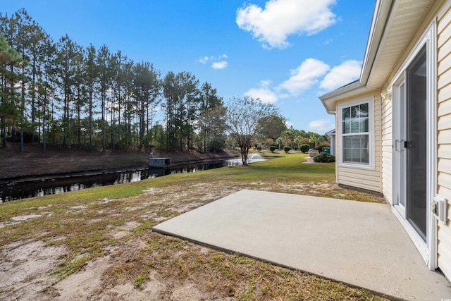 view of yard featuring a patio and a water view