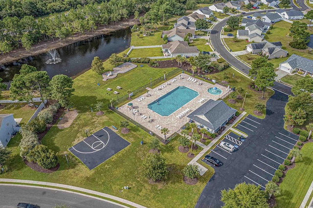 bird's eye view featuring a water view and a residential view