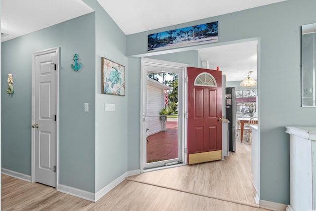 entrance foyer featuring wood finished floors and baseboards