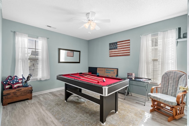 recreation room featuring baseboards, visible vents, wood finished floors, pool table, and a textured ceiling