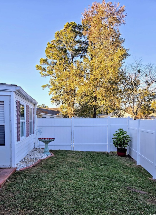 view of yard with a fenced backyard