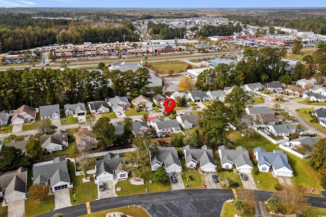 birds eye view of property with a residential view