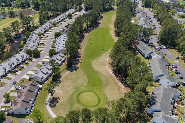 aerial view featuring view of golf course and a residential view