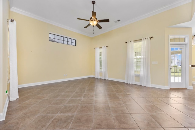 tiled spare room with ceiling fan and crown molding