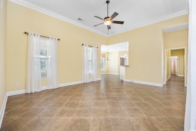 tiled empty room with ornamental molding, ceiling fan with notable chandelier, and a wealth of natural light