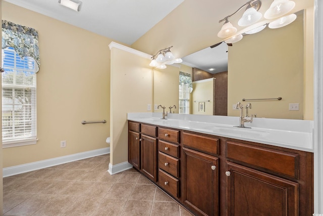 bathroom featuring tile patterned flooring, vanity, and toilet