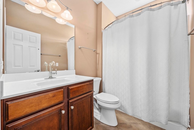 bathroom featuring walk in shower, vanity, tile patterned floors, and toilet