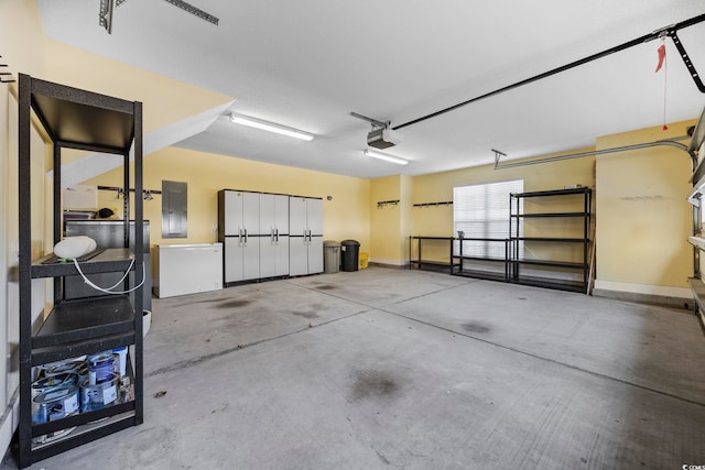 garage featuring a garage door opener and electric panel