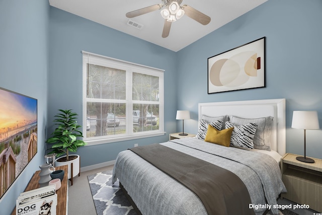 bedroom with ceiling fan and carpet floors