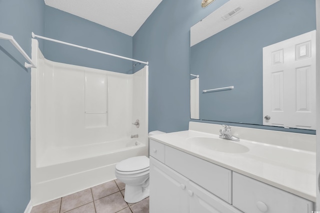 full bathroom featuring shower / bathing tub combination, a textured ceiling, toilet, tile patterned floors, and vanity