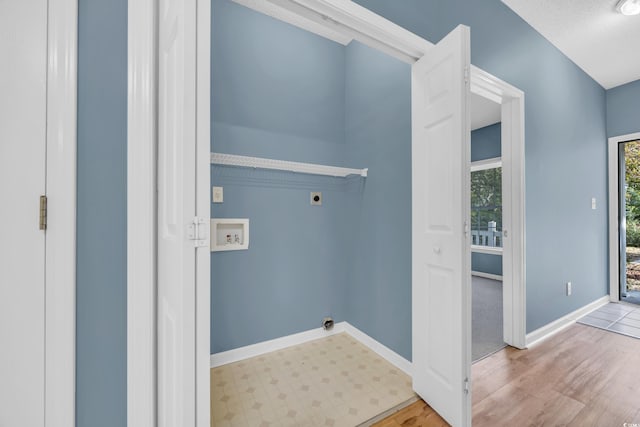 laundry room featuring light hardwood / wood-style flooring, washer hookup, and electric dryer hookup