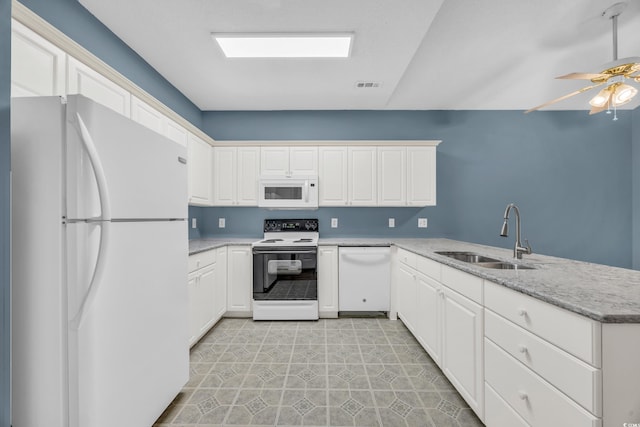 kitchen featuring kitchen peninsula, white cabinets, sink, and white appliances