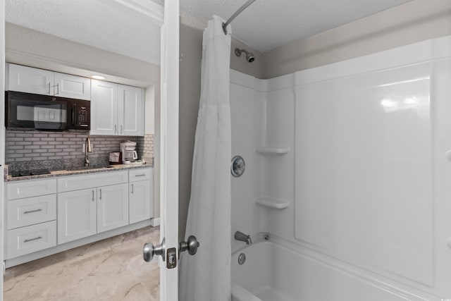 9550 Shore Dr Unit 1202, Myrtle Beach, SC 29572 - bathroom with shower / tub combo with curtain, decorative backsplash, and vanity