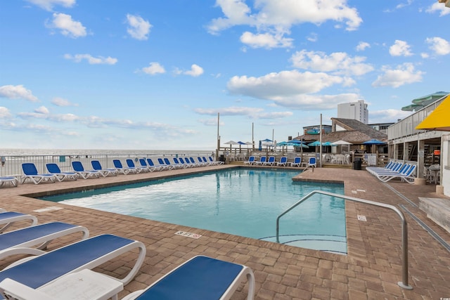 view of swimming pool featuring a patio area