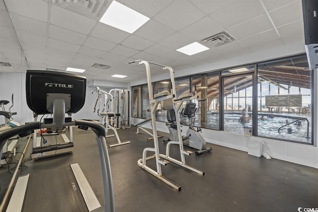 gym featuring a paneled ceiling